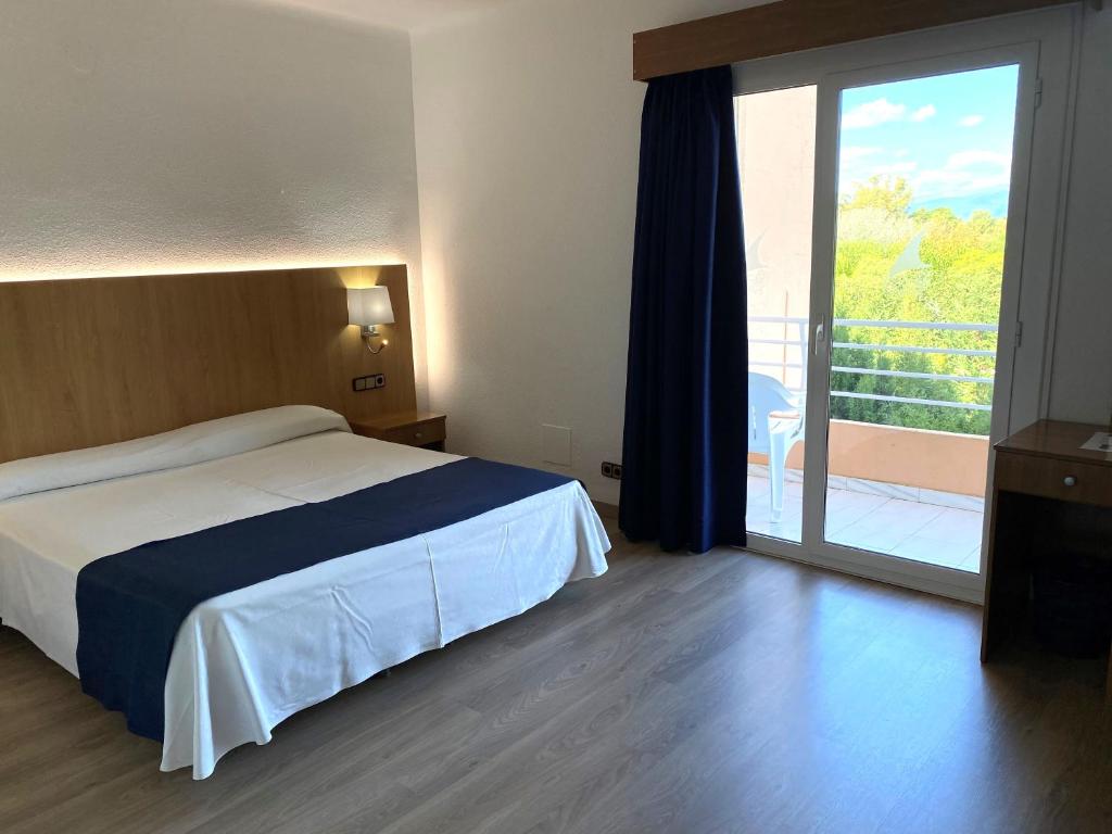 Postel nebo postele na pokoji v ubytování Nautilus Hotel