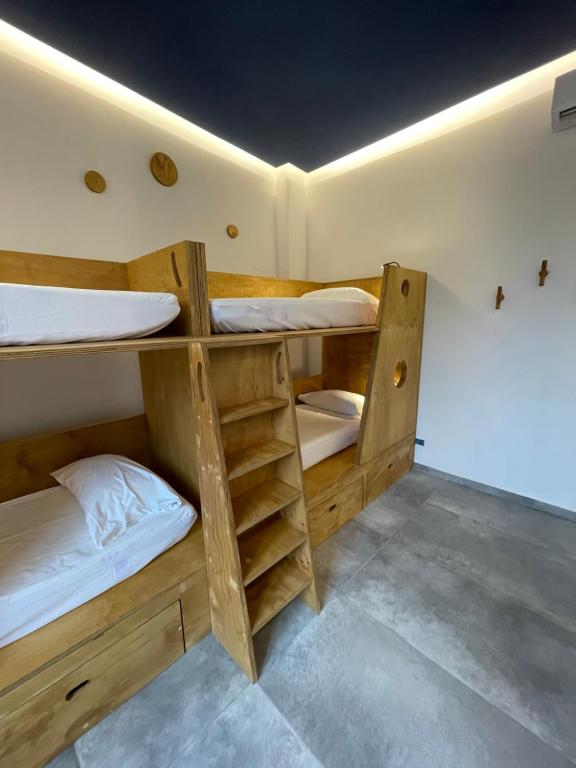 Postel nebo postele na pokoji v ubytování Hotel Paola