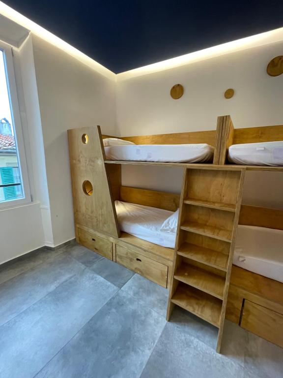 Postel nebo postele na pokoji v ubytování Hotel Paola