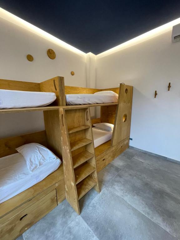 Postel nebo postele na pokoji v ubytování Hotel Paola
