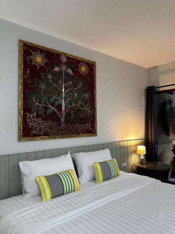Postel nebo postele na pokoji v ubytování Koko Palm Inn
