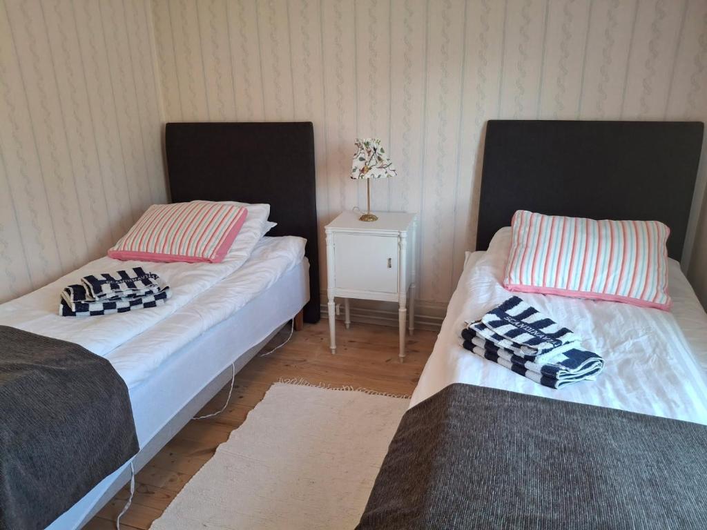 Postel nebo postele na pokoji v ubytování Kristbergs Rusthåll