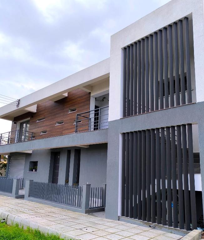a house with a lot of windows at George Apartments in Larnaca