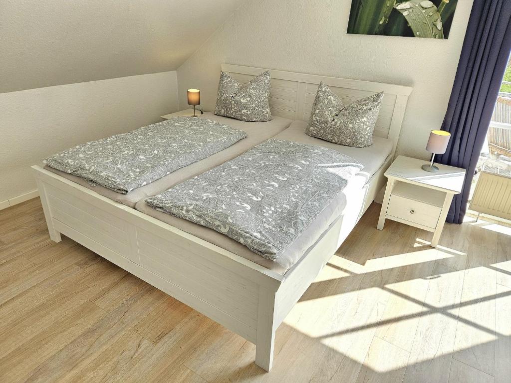 Postel nebo postele na pokoji v ubytování "Pappelhof - Whg 10"