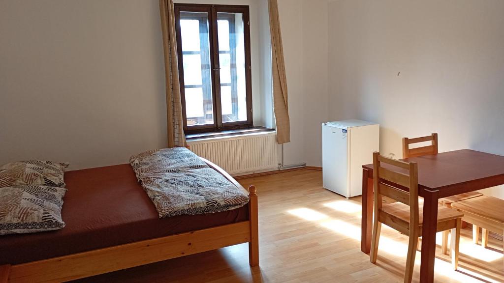 Postel nebo postele na pokoji v ubytování Penzion Zámek Drahonice