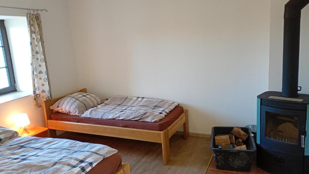 Postel nebo postele na pokoji v ubytování Penzion Zámek Drahonice