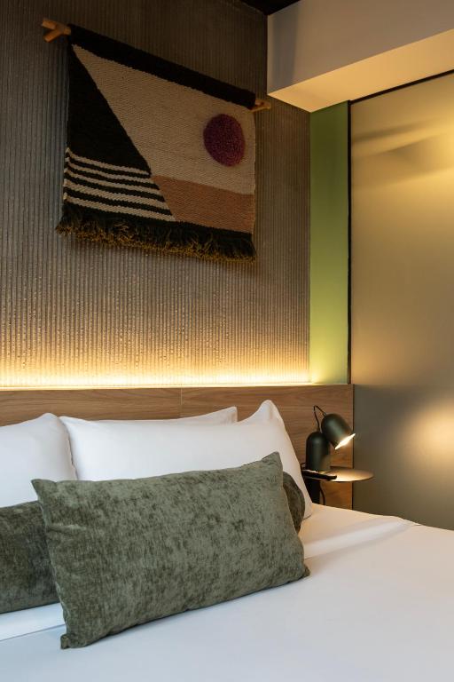 Postel nebo postele na pokoji v ubytování Hunters Hotel