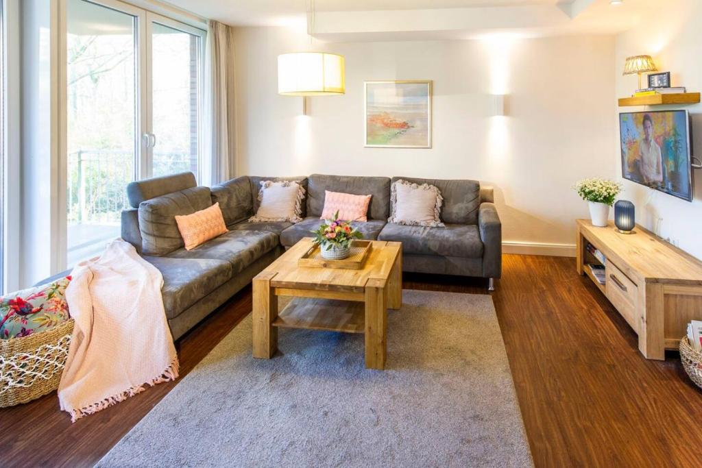 a living room with a couch and a coffee table at Oldenburg 03 in Wangerooge