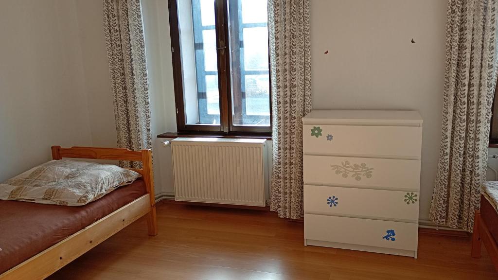 Postel nebo postele na pokoji v ubytování Penzion Zámek Drahonice