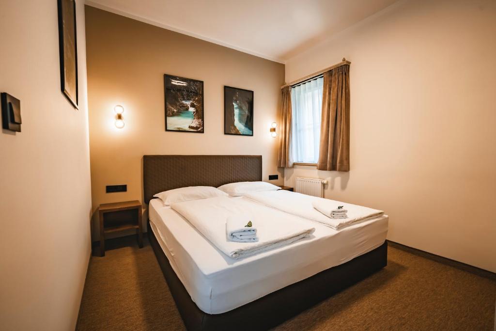 Postel nebo postele na pokoji v ubytování Guest House EJGA