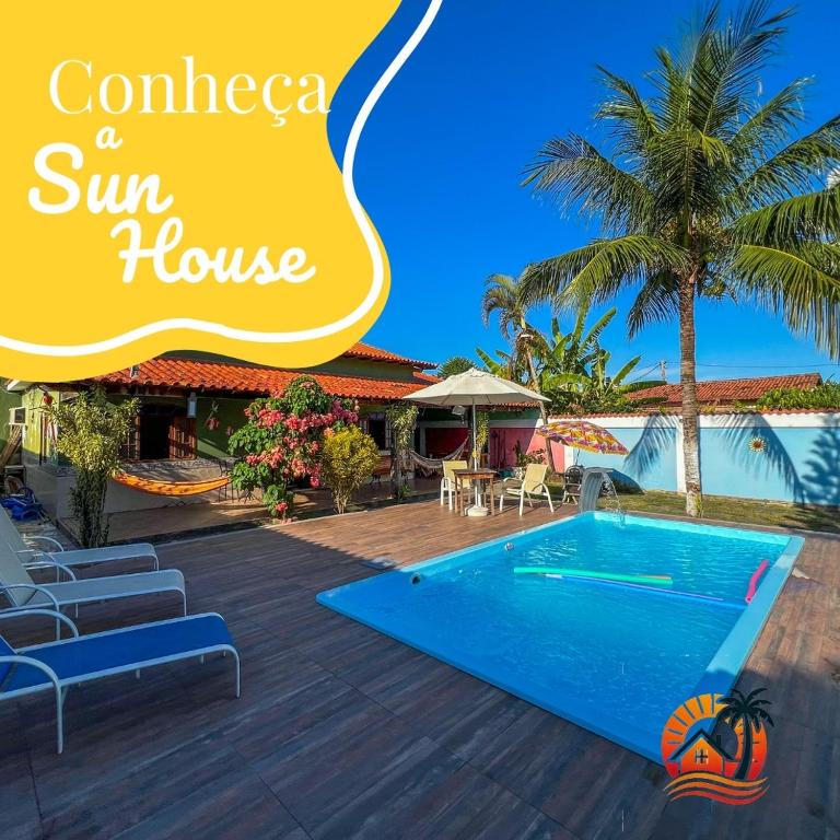 a resort with a swimming pool and a sun house at Sun House WSL in Saquarema