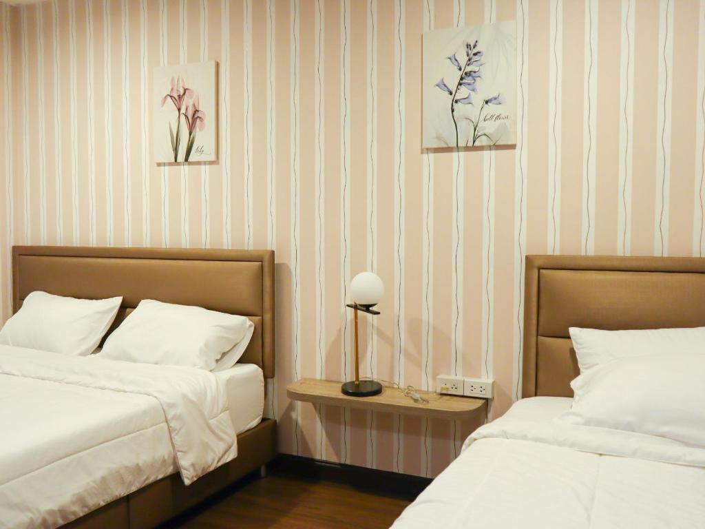 Postel nebo postele na pokoji v ubytování A Little Nap Hometel