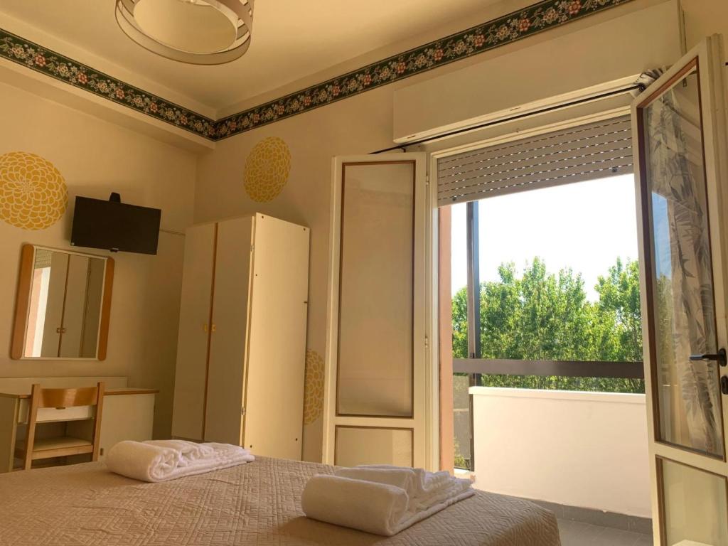 Postel nebo postele na pokoji v ubytování Smile Beach Hotel Nuova Gestione