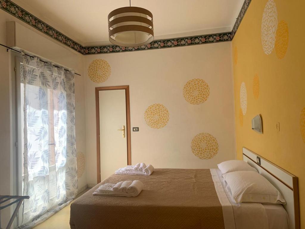 Postel nebo postele na pokoji v ubytování Smile Beach Hotel Nuova Gestione
