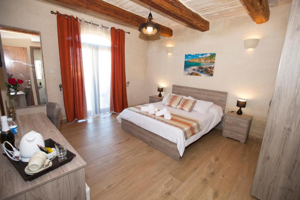 Postel nebo postele na pokoji v ubytování Soleil B&B Gozo