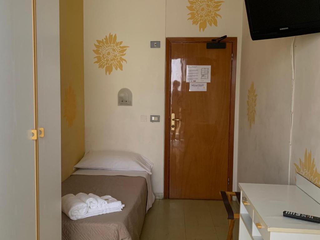 Postel nebo postele na pokoji v ubytování Smile Beach Hotel Nuova Gestione