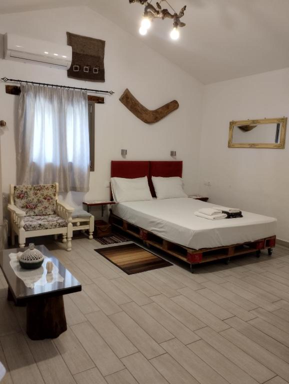 Postel nebo postele na pokoji v ubytování Olea Cottage