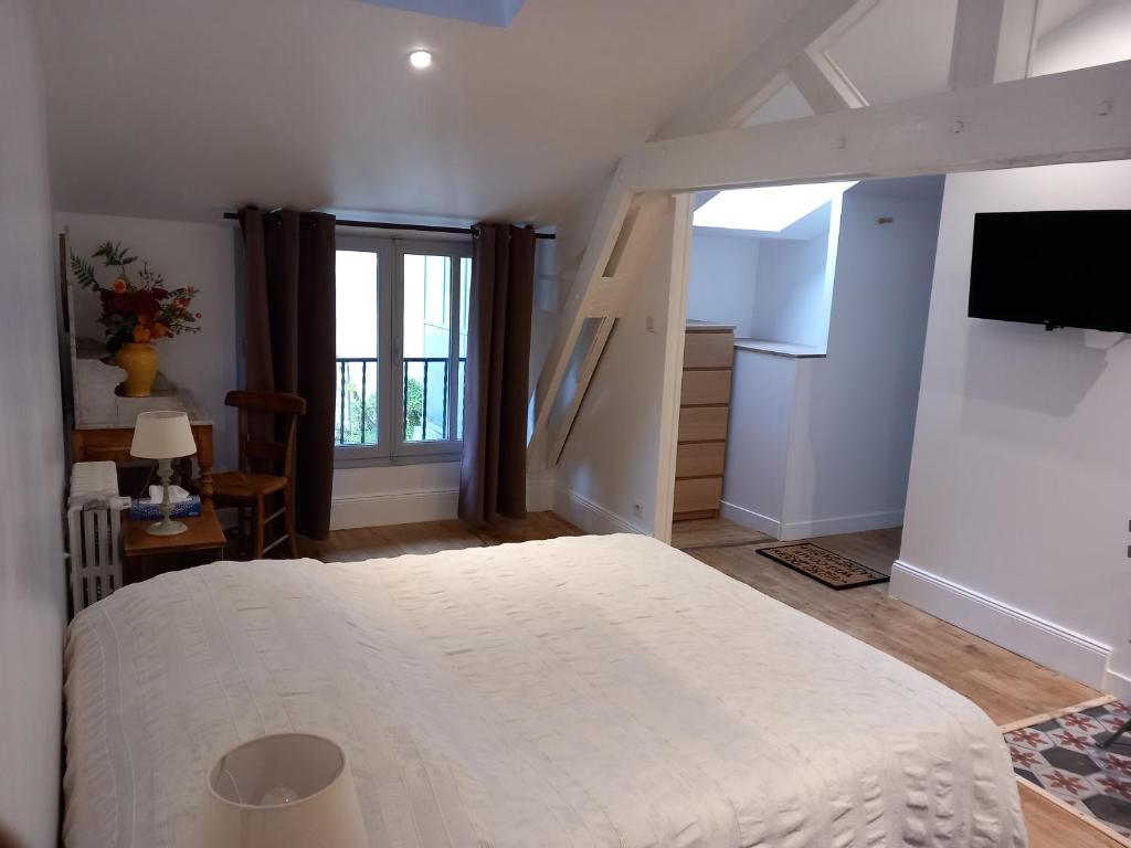 Postel nebo postele na pokoji v ubytování Maison Auctoire