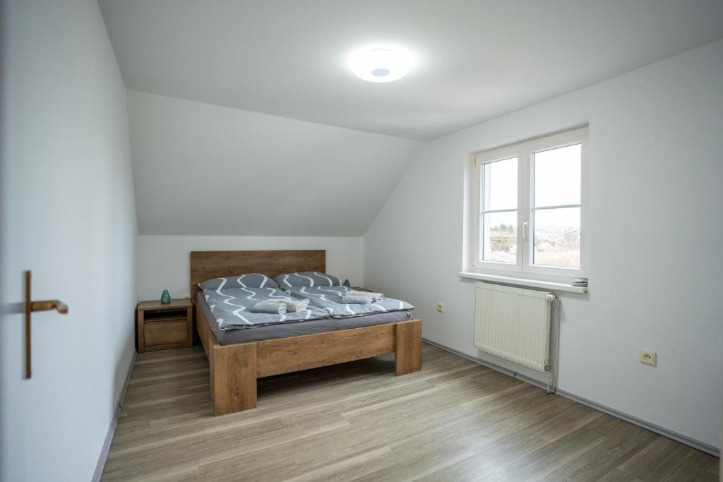 Postel nebo postele na pokoji v ubytování Apartmán Real