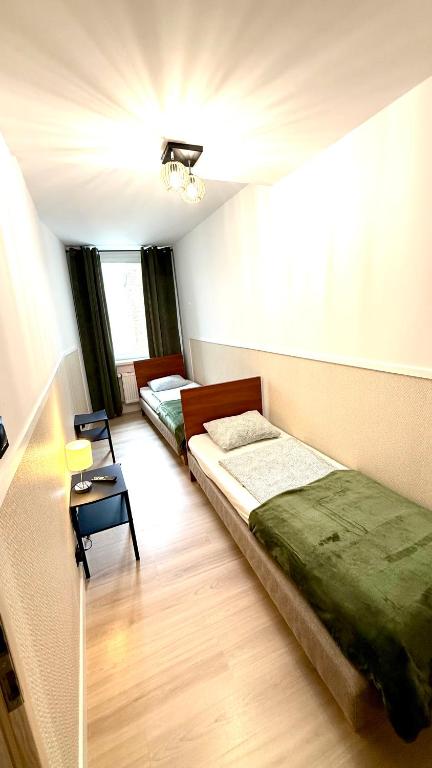 Postel nebo postele na pokoji v ubytování Green Hostel