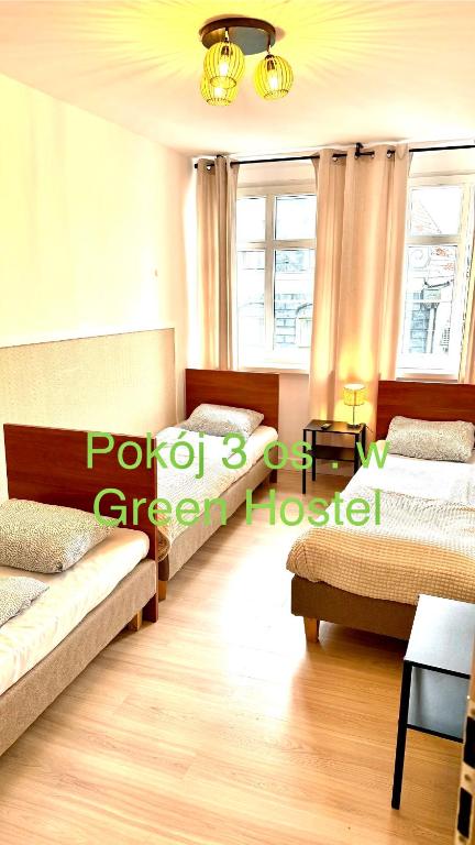 Postel nebo postele na pokoji v ubytování Green Hostel