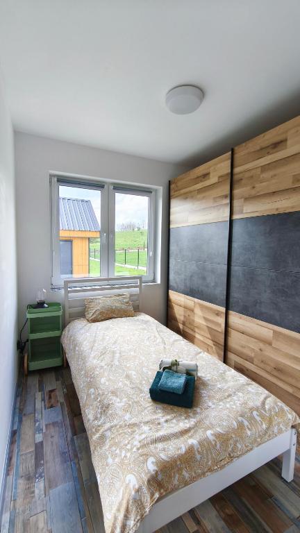 Postel nebo postele na pokoji v ubytování Wzgórze Jasia