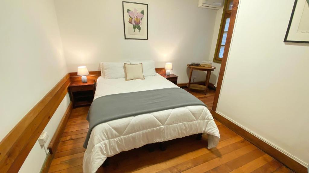 Postel nebo postele na pokoji v ubytování Cozy Place Hostal