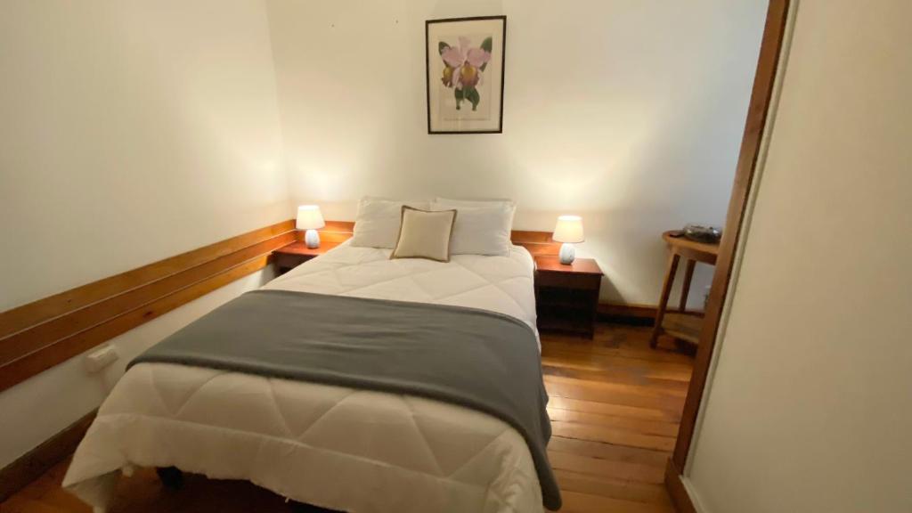 Postel nebo postele na pokoji v ubytování Cozy Place Hostal