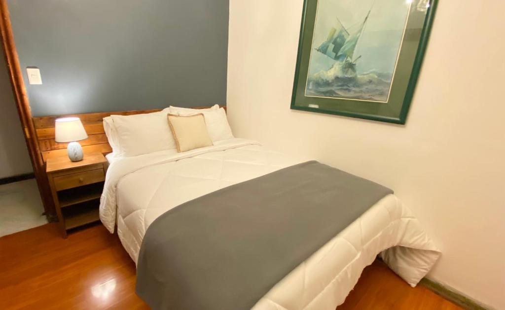 Postel nebo postele na pokoji v ubytování Cozy Place Hostal