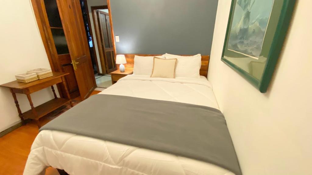 Postel nebo postele na pokoji v ubytování Cozy Place Hostal