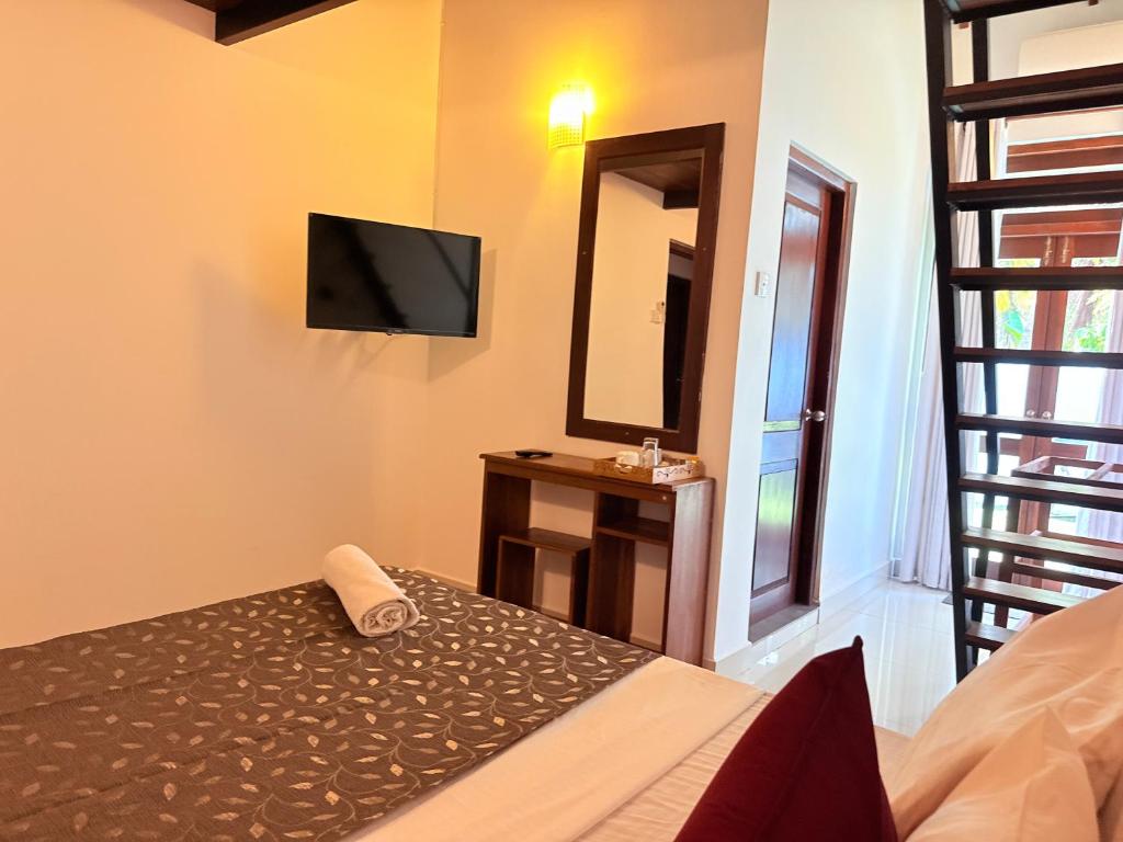 Postel nebo postele na pokoji v ubytování Thisara Luxury Villas