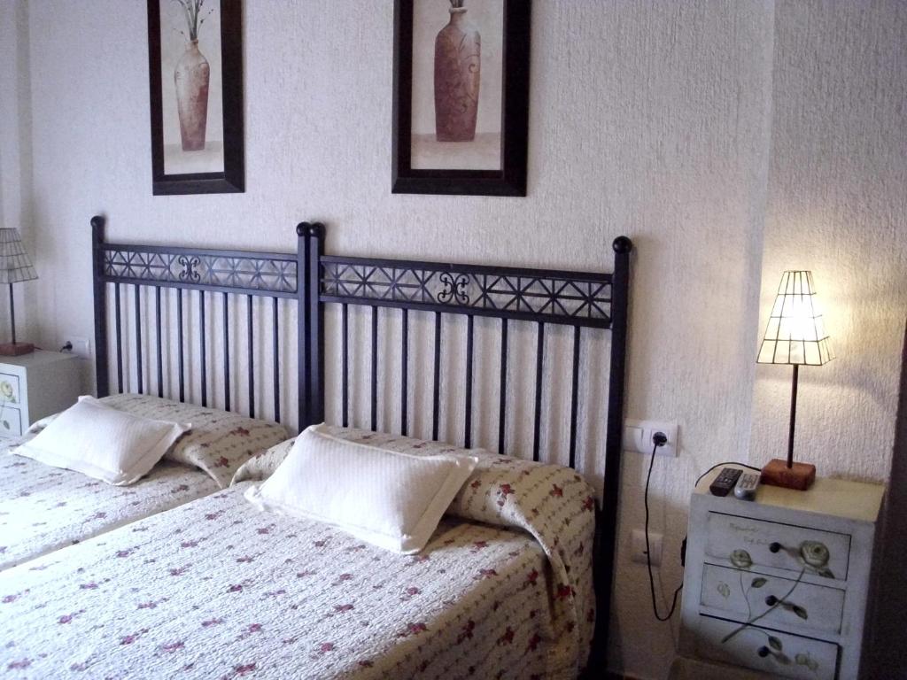 Postel nebo postele na pokoji v ubytování La Posada de Menchu