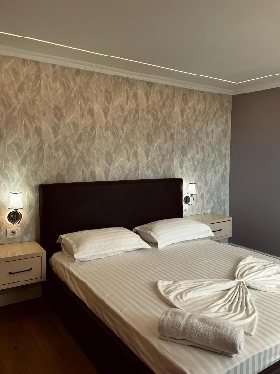 Postel nebo postele na pokoji v ubytování Bliss Boutique Hotel
