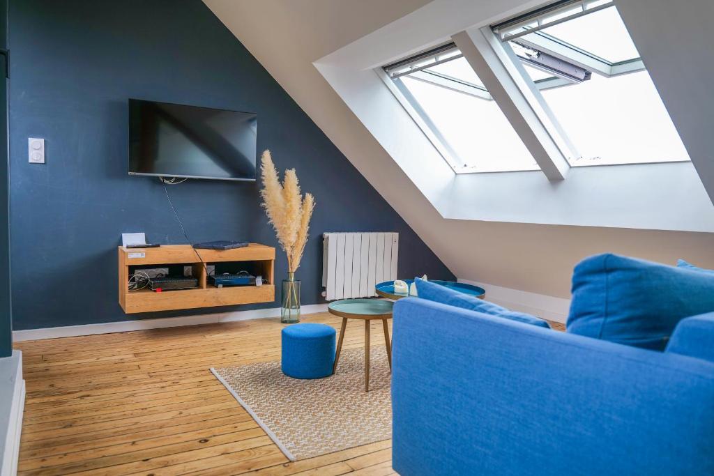 Μια τηλεόραση ή/και κέντρο ψυχαγωγίας στο Appartement très lumineux - vue sur la ville - 4 personnes