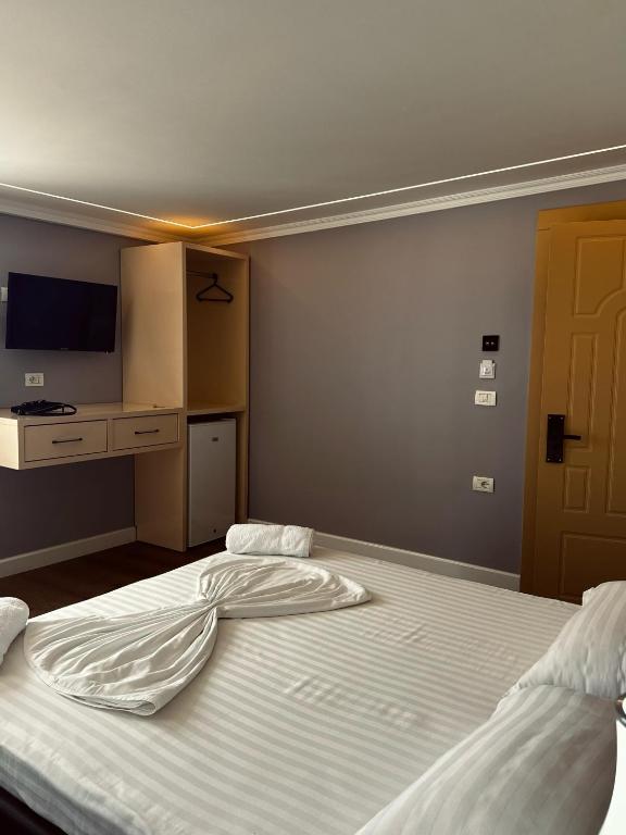 Postel nebo postele na pokoji v ubytování Bliss Boutique Hotel