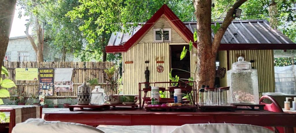a small house on a table in front of a fence at JUNGLE AERIAL ARTS NAMASTE LA UNION Chi fan kubo 2pax in Rimus