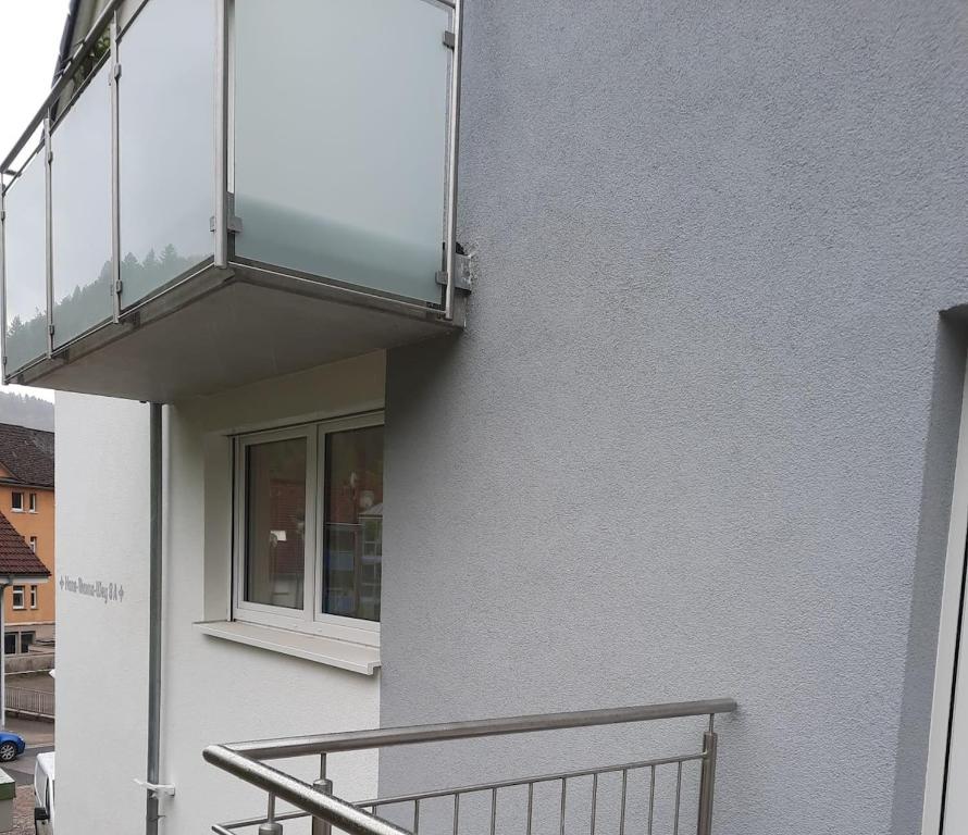 a balcony on the side of a building at Ferienwohnung Mergel in Black Forest in Zell im Wiesental