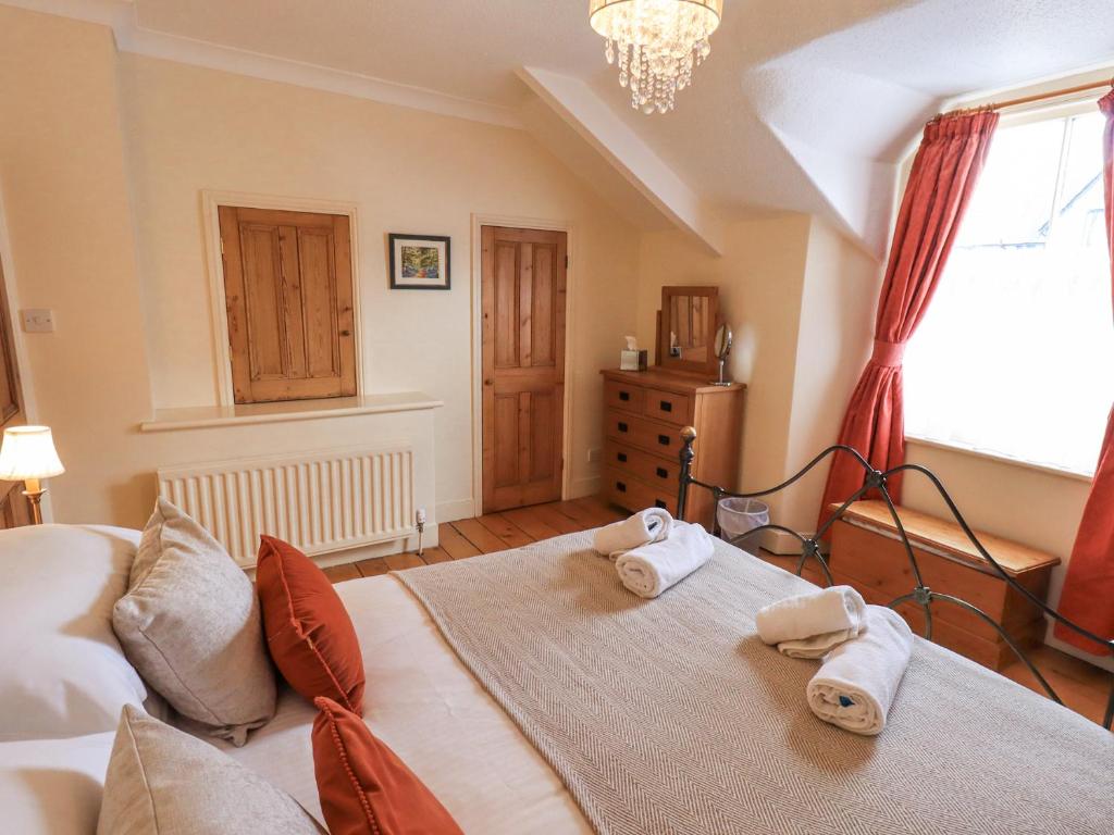 Postel nebo postele na pokoji v ubytování Primrose Cottage