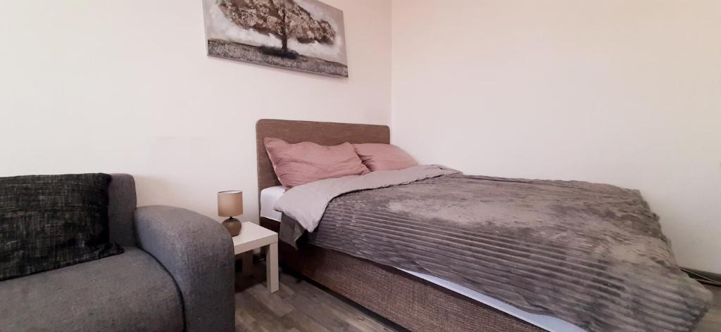 Postel nebo postele na pokoji v ubytování Apartman Dostojevski
