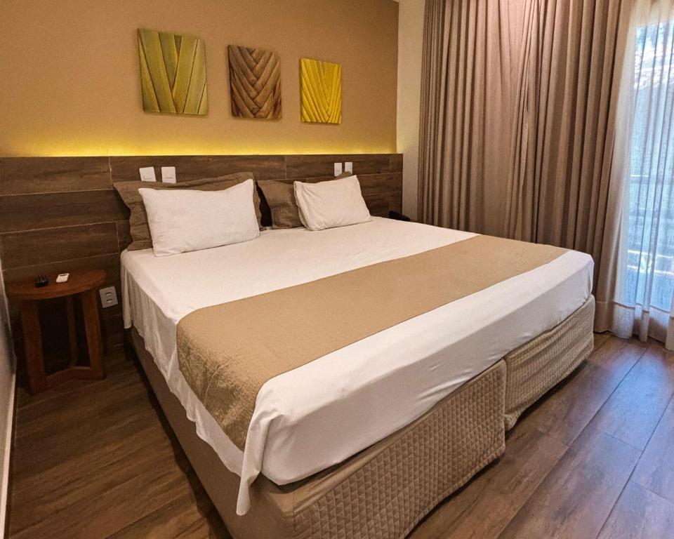 Postel nebo postele na pokoji v ubytování Ravenala Hotel