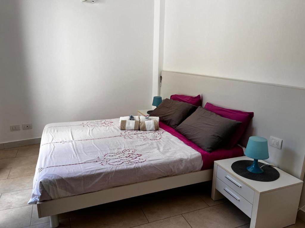 Cama ou camas em um quarto em Alla Scala colorata