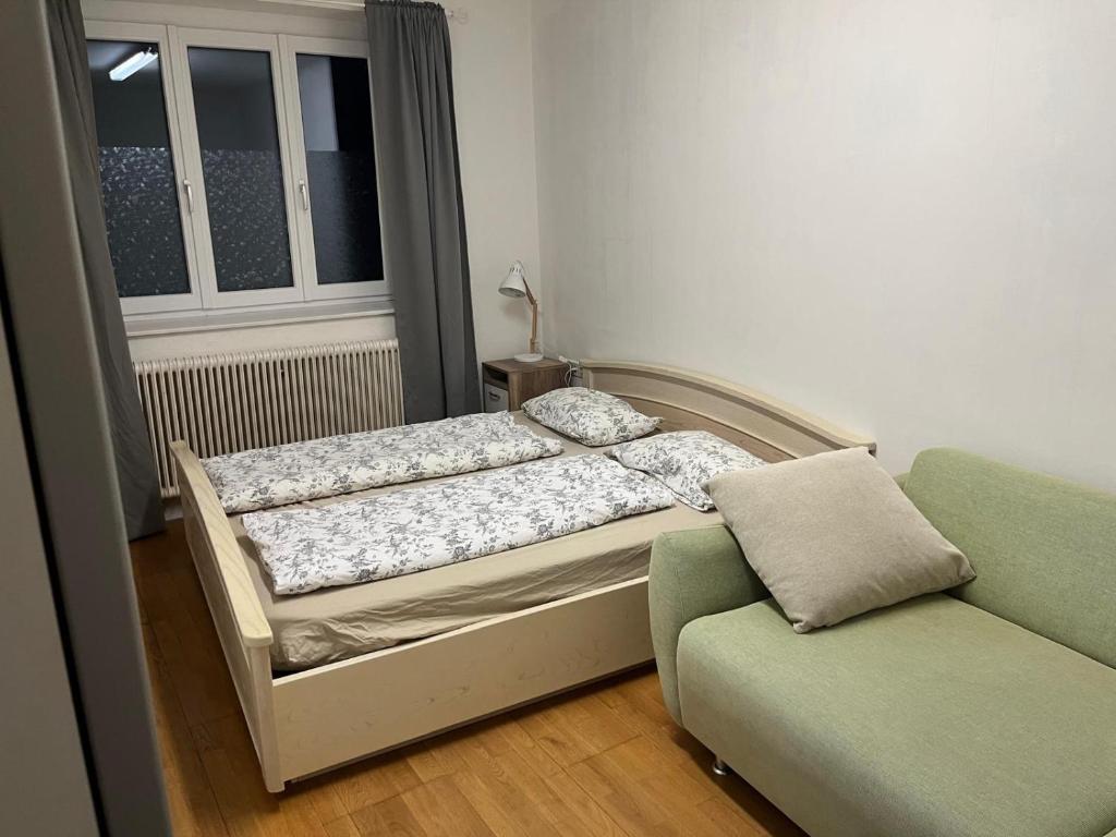 Postel nebo postele na pokoji v ubytování Gästehaus JaWo