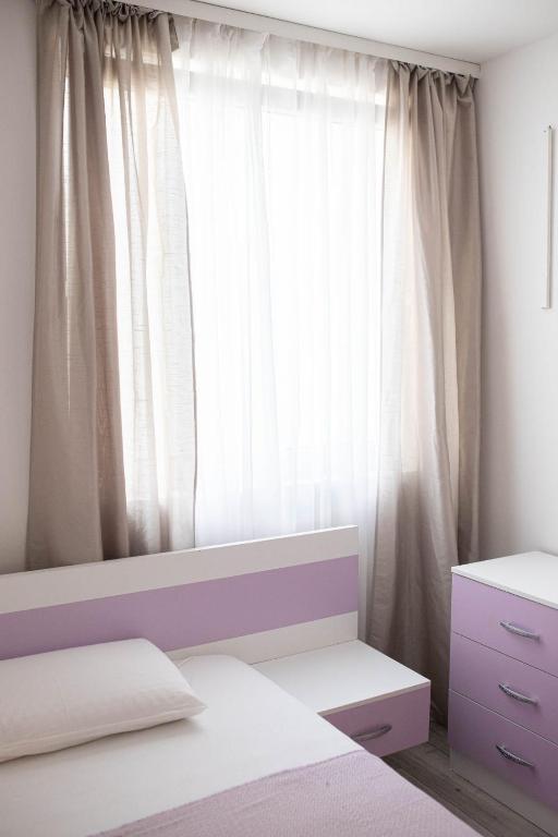 Posteľ alebo postele v izbe v ubytovaní Apartman „Bernarda”