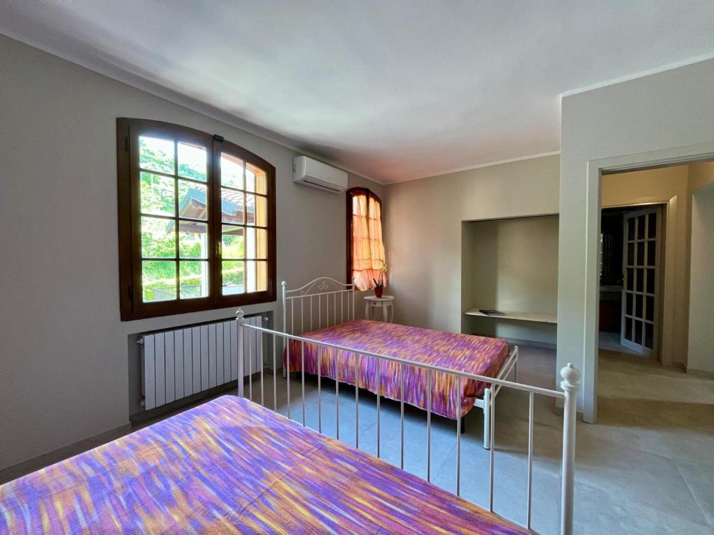 Postel nebo postele na pokoji v ubytování B&B Aria Di Lago