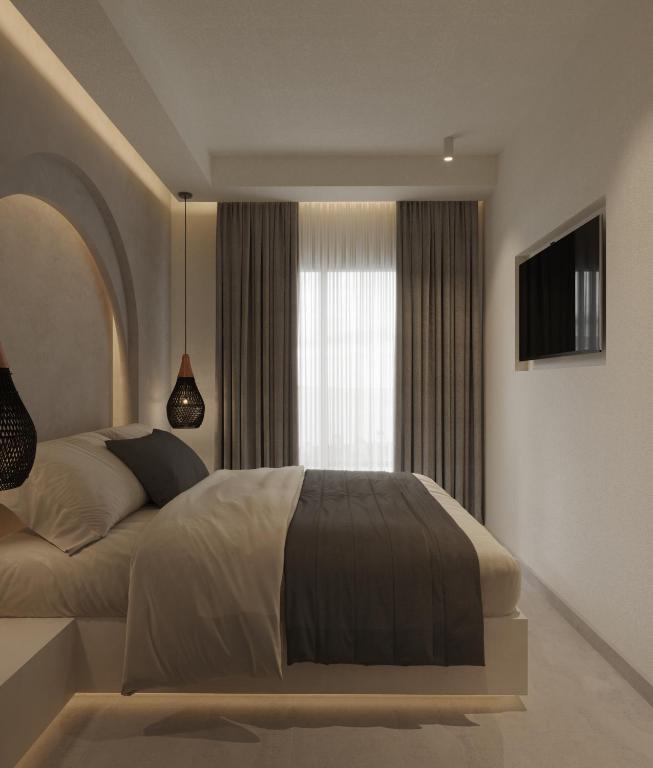 Postel nebo postele na pokoji v ubytování néreya luxury rooms