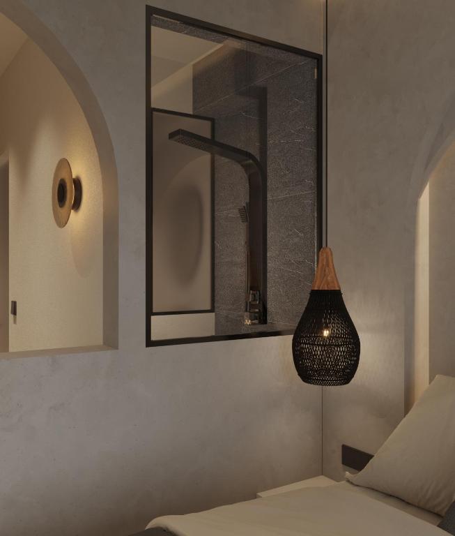 Postel nebo postele na pokoji v ubytování néreya luxury rooms