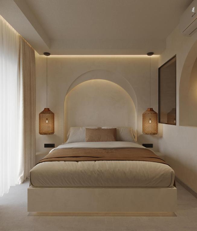 Postel nebo postele na pokoji v ubytování néreya luxury rooms