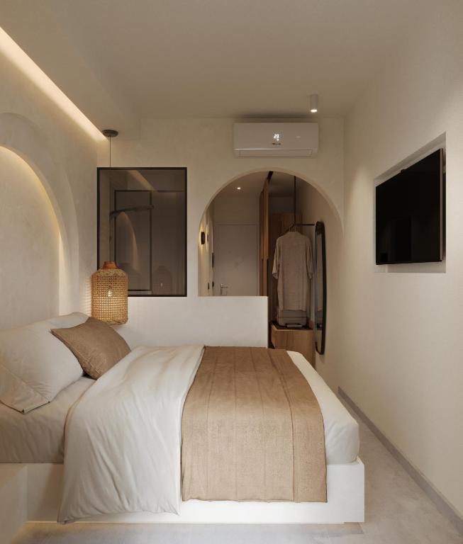 Postel nebo postele na pokoji v ubytování néreya luxury rooms