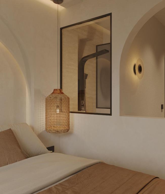 Postel nebo postele na pokoji v ubytování néreya luxury rooms