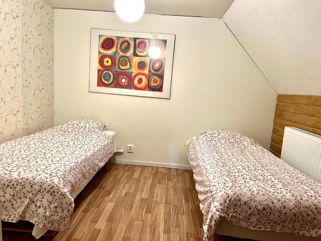 Postel nebo postele na pokoji v ubytování Kvistrom Inn - Kviströms Gästgiveri